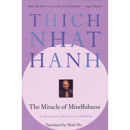 The Miracle of Mindfulness paperback book by Thich Nhat Hanh featuring a lavender cover with the author's name prominently displayed. — for Carpe Diem Dream
