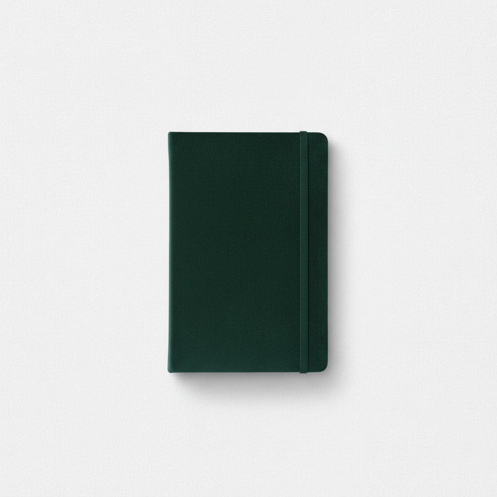 A dark green velvet hard cover journal with an elastic band closure displayed upright on a clean neutral background. — for Carpe Diem Dream