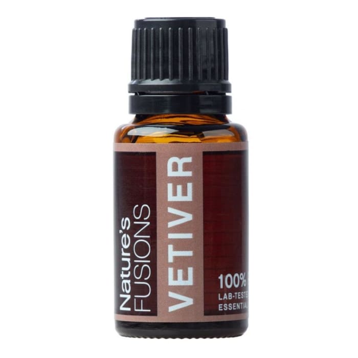 Amber glass bottle of Vetiver Essential Oil with black ribbed cap and maroon label on white background. — for Carpe Diem Dream