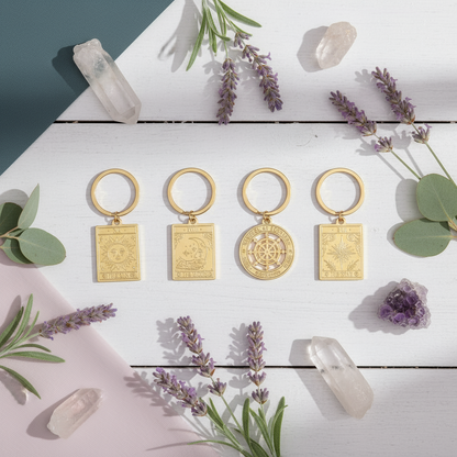 Vintage Tarot Card Keyrings arranged on a white wooden deck surrounded by lavender sprigs, eucalyptus leaves, and quartz crystals, captured in natural sunlight with Carpe Diem Dream’s serene boho-mystical aesthetic.