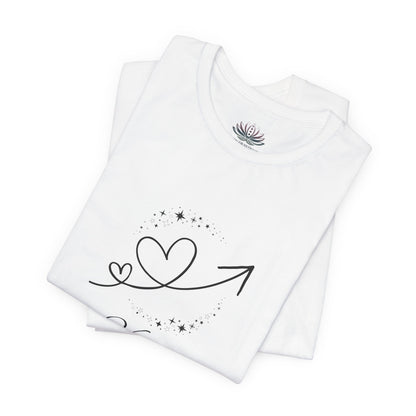 Virgo Rising I Refine zodiac T-shirt in white with black celestial heart and arrow artwork, shown folded in a supplier mockup. — for Carpe Diem Dream