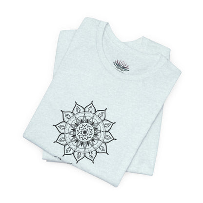 Virgo Sun I Analyze zodiac T-shirt in heather ice blue with black sun-inspired mandala artwork, shown folded with Carpe Diem Dream neck label in a supplier mockup. — for Carpe Diem Dream