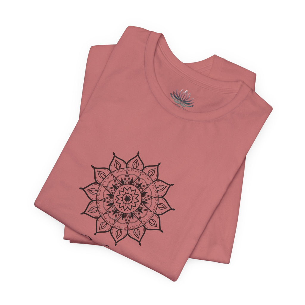 Virgo Sun I Analyze zodiac T-shirt in mauve with black sun-inspired mandala artwork, shown folded with Carpe Diem Dream neck label in a supplier mockup. — for Carpe Diem Dream