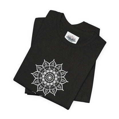 Virgo Sun I Analyze zodiac T-shirt in black heather with white sun-inspired mandala artwork, shown folded with Carpe Diem Dream neck label in a supplier mockup. — for Carpe Diem Dream