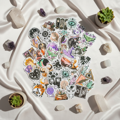 Witchy boho matte sticker set arranged on soft ivory fabric with crystals and small succulents in natural light. — for Carpe Diem Dream