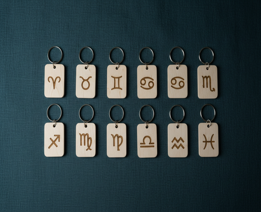Wood Engraved Zodiac Keychains on Teal-Grey Linen —  for Carpe Diem Dream