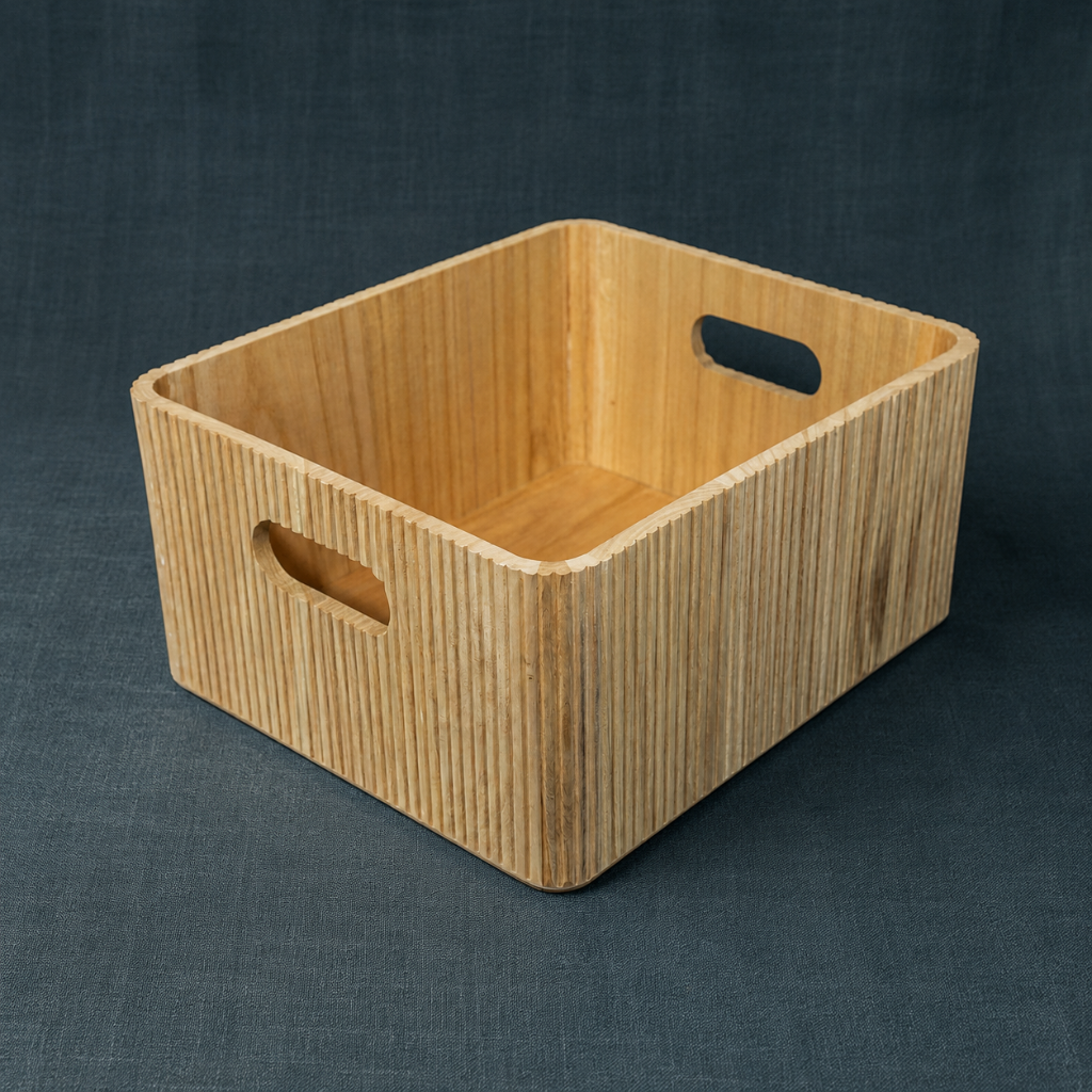 Natural wooden ribbed storage bin with rounded edges and cutout handles on a dark teal textured linen backdrop. — Carpe Diem Dream