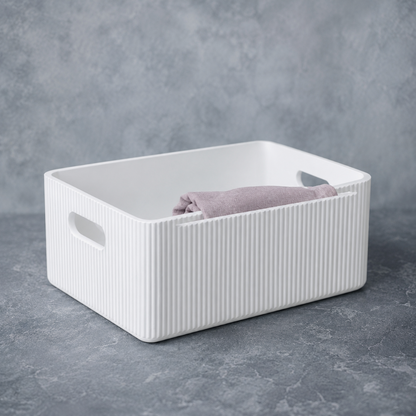 White wooden ribbed storage bin professionally styled with soft lavender linen in a refined editorial studio setting. — for Carpe Diem Dream