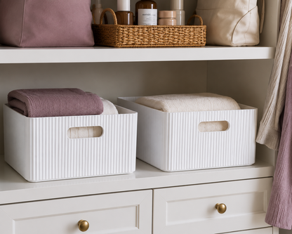 White wooden ribbed storage bins shown in use on closet shelves with folded linens, soft mauve textiles, and everyday organization accents. — for Carpe Diem Dream