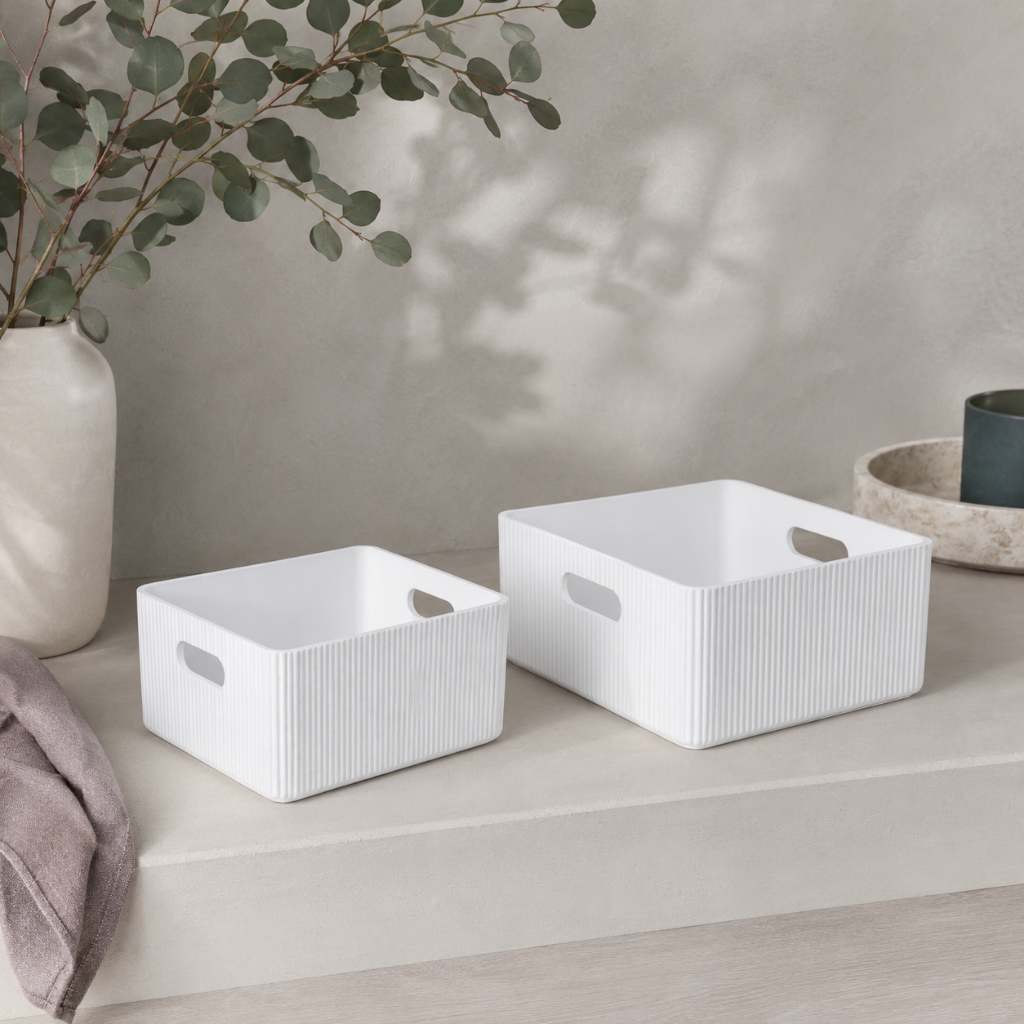 White wooden ribbed storage bins styled in a botanical studio with eucalyptus, mauve linen, soft stone surfaces, and cool neutral ceramics. — for Carpe Diem Dream