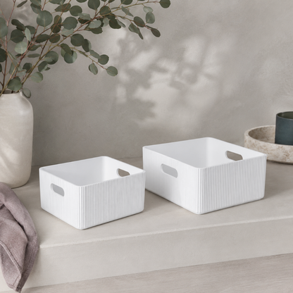White wooden ribbed storage bins styled in a botanical studio with eucalyptus, mauve linen, soft stone surfaces, and cool neutral ceramics. — for Carpe Diem Dream