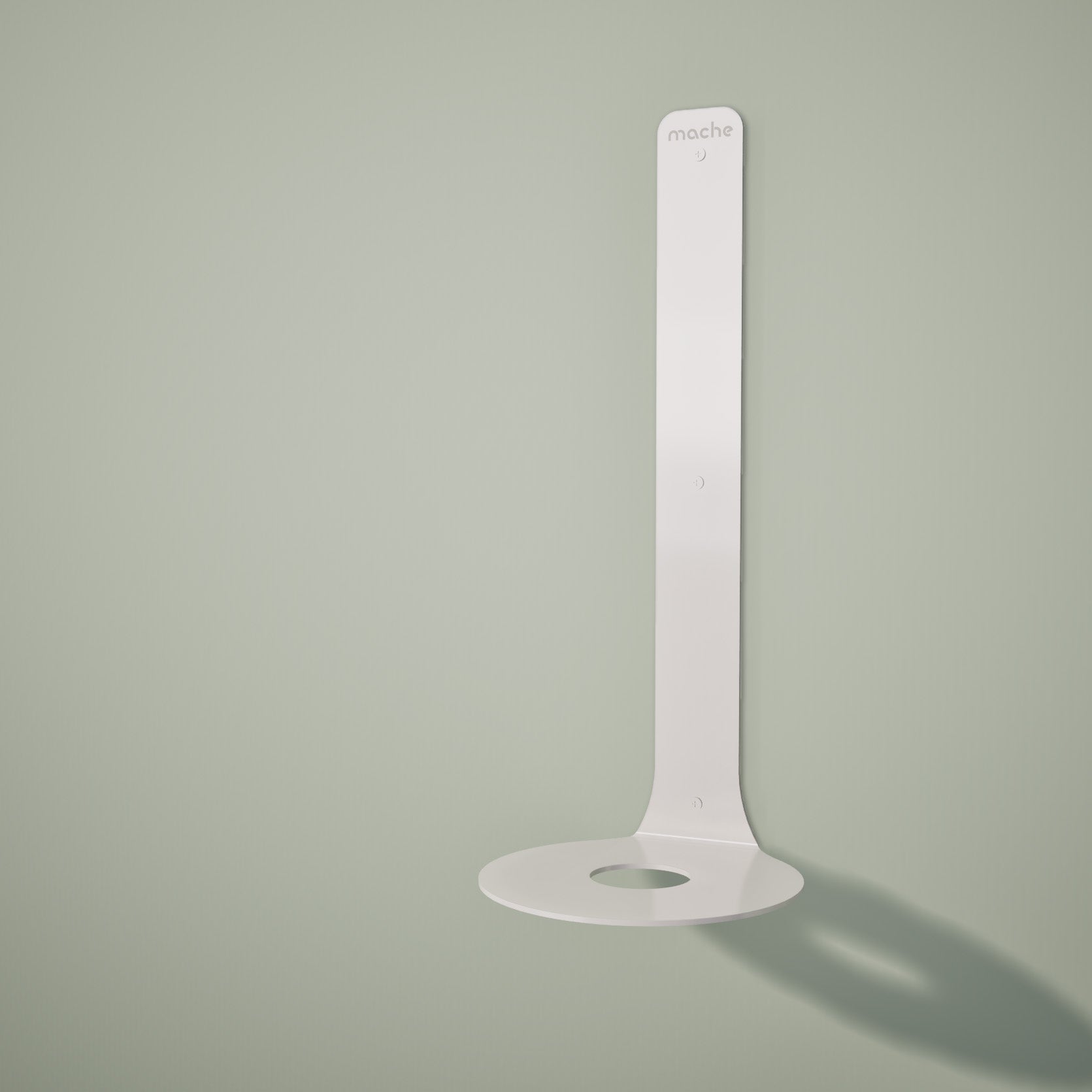 White Yoke yoga block wall bracket displayed empty against a pale green background. — for Carpe Diem Dream